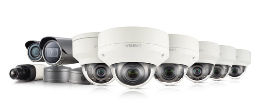 A row of Hanwha Techwin security camera models, showcasing various designs and features. The image highlights the range of surveillance solutions available, with each camera model displayed in a clear, organized arrangement.